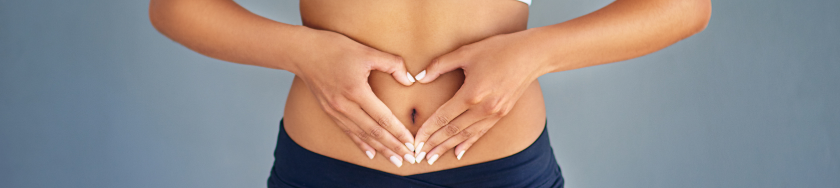 Frau hält Bauch Probiotika